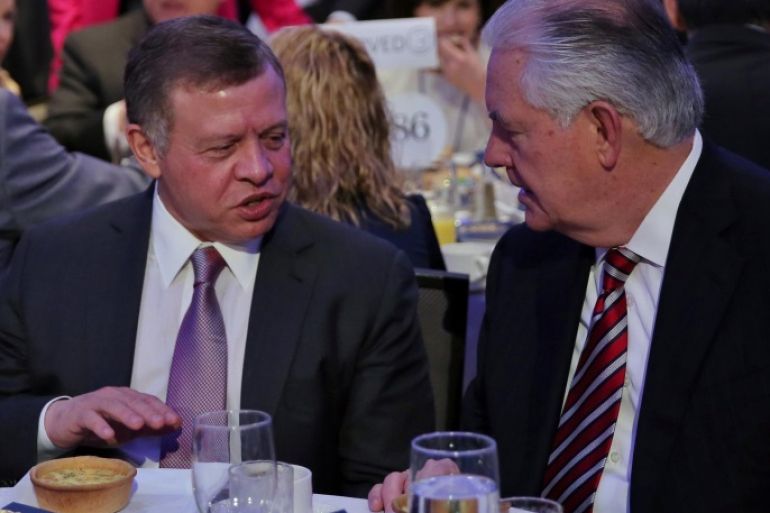 Jordan's King Abdullah (L) speaks with Secretary of State Rex Tillerson at the National Prayer Breakfast in Washington, U.S., February 2, 2017. REUTERS/Carlos Barria
