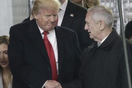 President Donald J. Trump (L) shakes hands with Retired Marine General James Mattis shortly after he was confirmed 98-1 by the Senate to serve as Secretary of Defense as they sit in the reviewing stand during the Inaugural Parade after he was sworn in as the 45th President of the United States in Washington, DC, USA, 20 January 2017. Trump won the 08 November 2016 election to become the next US President.