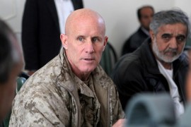 FILE PHOTO - Vice Adm. Robert S. Harward, commanding officer of Combined Joint Interagency Task Force 435, speaks to an Afghan official during his visit to Zaranj, Afghanistan, in this January 6, 2011 handout photo. Sgt. Shawn Coolman/U.S. Marines/Handout via REUTERS/File Photo ATTENTION EDITORS - THIS IMAGE WAS PROVIDED BY A THIRD PARTY. EDITORIAL USE ONLY TPX IMAGES OF THE DAY