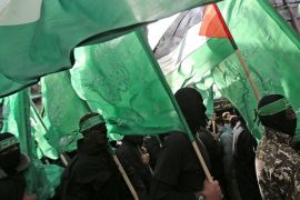 Fighters of Ezz-Al Din Al Qassam Brigades, the armed wing of the Palestinain Hamas movement march during a Hamas rally marking the group's 29th anniversary in the streets of Gaza City, 14 December 2016.