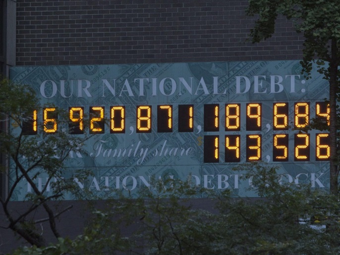 The national Debt Clock is seen in New York October 15, 2013. REUTERS/Andrew Kelly (UNITED STATES - Tags: ENVIRONMENT BUSINESS)