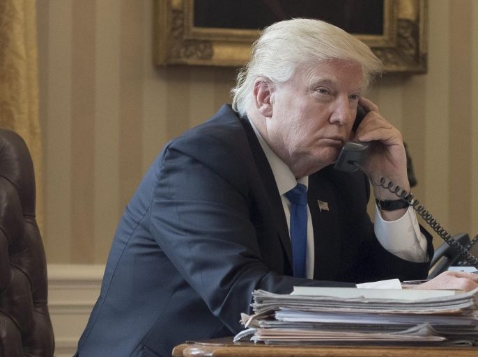 US President Donald J. Trump speaks on the phone with President of Russia Vladimir Putin, in the Oval Office of the White House in Washington, DC, USA, 28 January 2017. President Trump has chosen the day to talk with different world leaders, significantly Russia's Vladimir Putin and Germany's Angela Merkel by telephone.