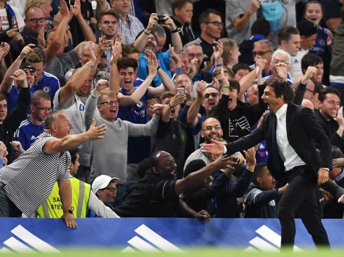 Britain Football Soccer - Chelsea v West Ham United - Premier League - Stamford Bridge - 15/8/16 Chelsea manager Antonio Conte celebrates with fans after Diego Costa scored their second goal Action Images via Reuters / Tony O'Brien Livepic EDITORIAL USE ONLY. No use with unauthorized audio, video, data, fixture lists, club/league logos or "live" services. Online in-match use limited to 45 images, no video emulation. No use in betting, games or single club/league/player publications. Please contact your account representative for further details.