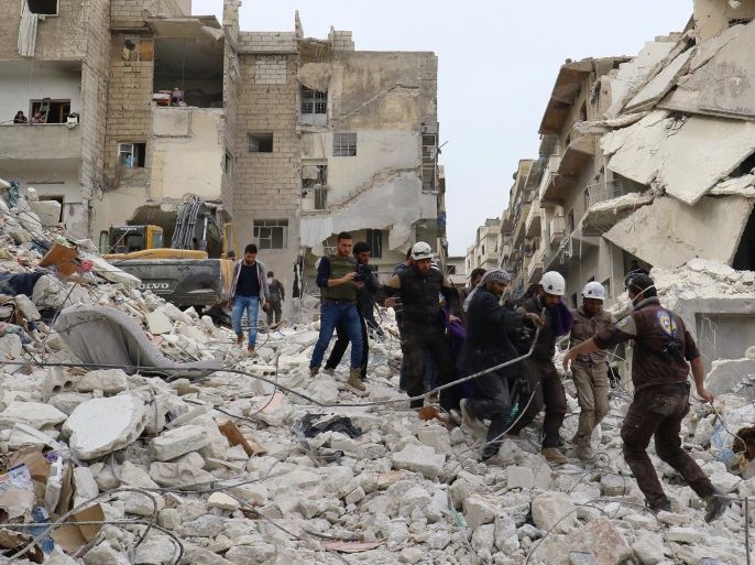 Civil defence members work at a site hit at dawn by an airstrike in the rebel-controlled town of Ariha in Idlib province, Syria, February 27, 2017. REUTERS/Ammar Abdullah