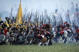 Reenactors perform on the battle field during the first reenactment of 'The French Attack' during the bicentennial celebrations for the Battle of Waterloo, in Braine l'Alleud, Belgium, 19 June 2015. Some 5,000 re-enactors, 300 horses and 100 canons are participating on 19 and 20 June 2015 in the reenactment of the legendary battle in which the Duke of Wellington won a definitive victory over French emperor Napoleon Bonaparte in 1815. EPA/OLIVIER HOSLET FOR EDITORIAL