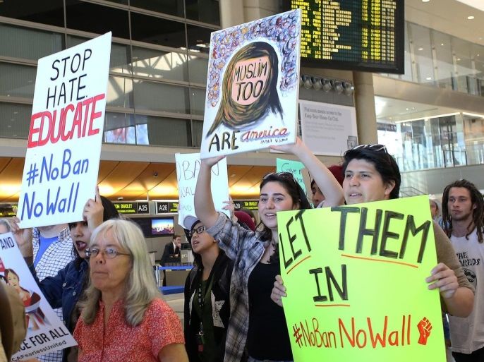 People gather to protest against U.S. President Donald Trump's executive order travel ban at Los Angeles International Airport (LAX), California, U.S. January 31, 2017. REUTERS/Monica Almeida