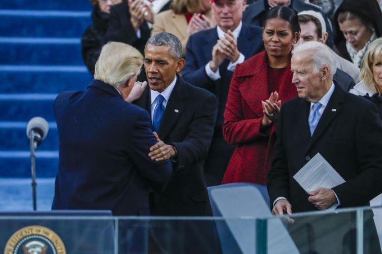 Former Vice President Joe Biden (R) watches as President Donald J. Trump (L) is embraced by former President Barack Obama (C) after delivering his Inaugural address after taking the oath of office as the 45th President of the United States in Washington, DC, USA, 20 January 2017. Trump won the 08 November 2016 election to become the next US President.