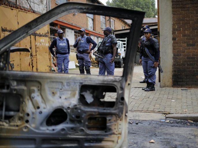 Members of the South African Police forces patrol an area around the Jeppe Street men's hostel where local South African men attacked shops owned by foreign nationals overnight in downtown Johannesburg, South Africa, 27 February 2017. Incidents of xenophobic attacks have occurred in both Pretoria and Johannesburg over the past week. Local police forces have been increased in the hot spots to try to contain the outbreak.
