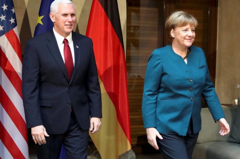 German Chancellor Angela Merkel walks with U.S. Vice President Mike Pence before their meeting at the 53rd Munich Security Conference in Munich, Germany, February 18, 2017. REUTERS/Michael Dalder TPX IMAGES OF THE DAY