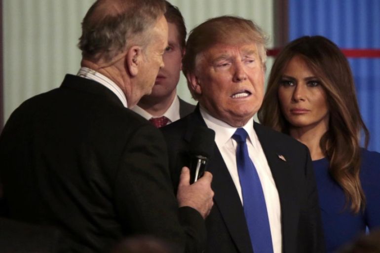 Republican U.S. presidential candidate Donald Trump (C) is interviewed by Fox News talk show host Bill O'Reilly (L) as Trump's wife Melania (R) looks on at the conclusion of the U.S. Republican presidential candidates debate in Detroit, Michigan, March 3, 2016. REUTERS/Rebecca Cook