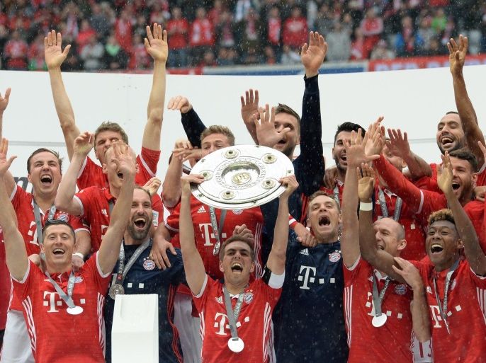 Captain Philipp Lahm celebrates with his team and the championship trophy at the German Bundesliga soccer match between FC Bayern Munich and Hanover 96 at Allianz Arena in Munich, Germany, 14 May 2016. (EMBARGO CONDITIONS - ATTENTION: Due to the accreditation guidlines, the DFL only permits the publication and utilisation of up to 15 pictures per match on the internet and in online media during the match.)