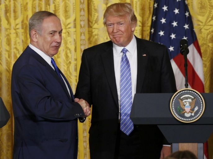 U.S. President Donald Trump (R) greets Israeli Prime Minister Benjamin Netanyahu after a joint news conference at the White House in Washington, U.S., February 15, 2017. REUTERS/Kevin Lamarque