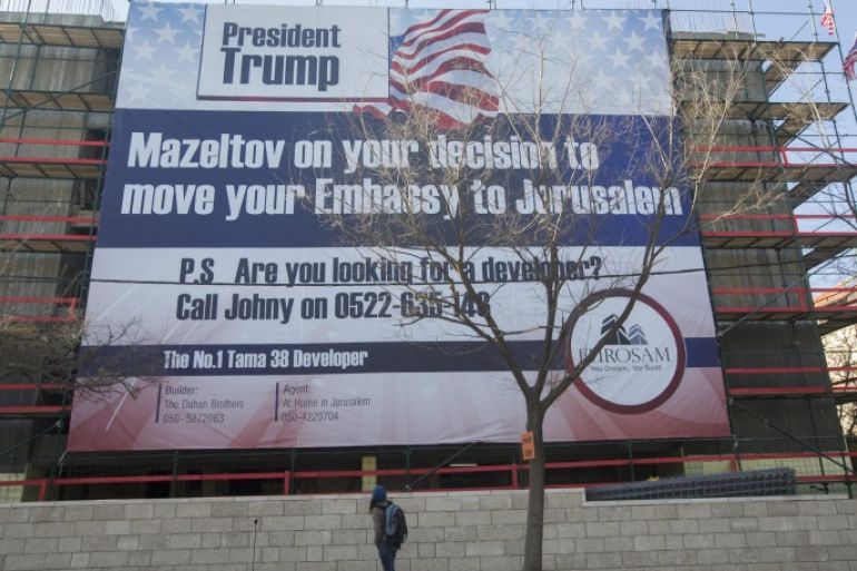 Israelis passing a Pro-US President-elect Donald Trump Banner with the Hebrew words Mazeltov, reading Congratulations, display on a building at Bethlehem street in Jerusalem, Israel , 20 January 2017. Trump won the 08 November 2016 , and promised during the election campaign, to move the US Embassy from Tel Aviv to Jerusalem.