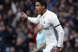 Real Madrid's French defender Raphael Varane (C) jubilates his goal against Sevilla FC during their round of 16th of the King's Cup first leg match against Sevilla FC played at Santiago Bernabeu stadium in Madrid, Spain on 04 January 2017.
