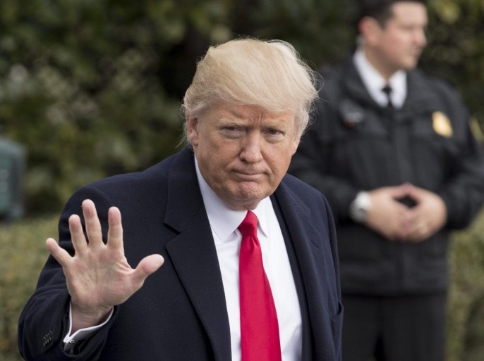 US President Donald J. Trump (Front) waves in front of a member of the US Secret Service (Back) while walking on the South Driveway of the White House to depart by 'Marine One' on the South Lawn, in Washington, DC, USA, 03 February 2017. President Trump departs to spend the weekend in West Palm Beach, Florida.