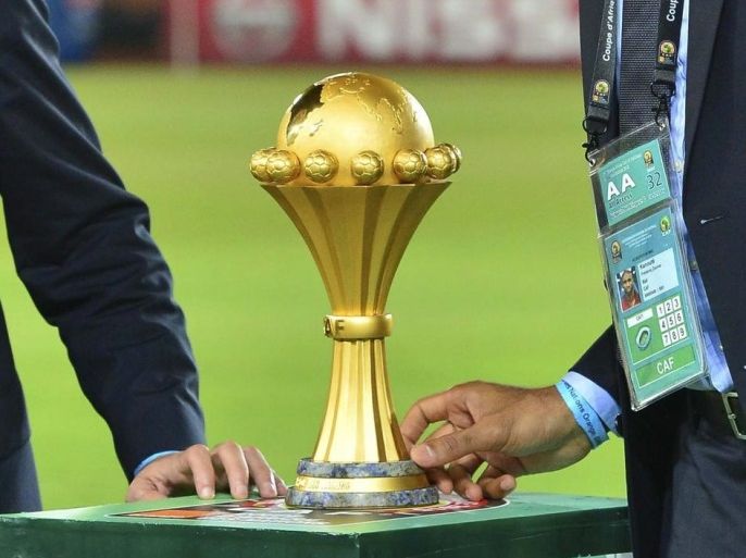 Confederation of African Football (CAF) ambassadors Mohamed Aboutrika (L) and Frederick Kanoute (R) with the trophy before the 2015 Africa Cup of Nations final soccer match between Ivory Coast and Ghana at the Bata Stadium in Bata, Equatorial Guinea, 08 February 2015. EPA/BARRY ALDWORTH UK AND IRELAND OUT