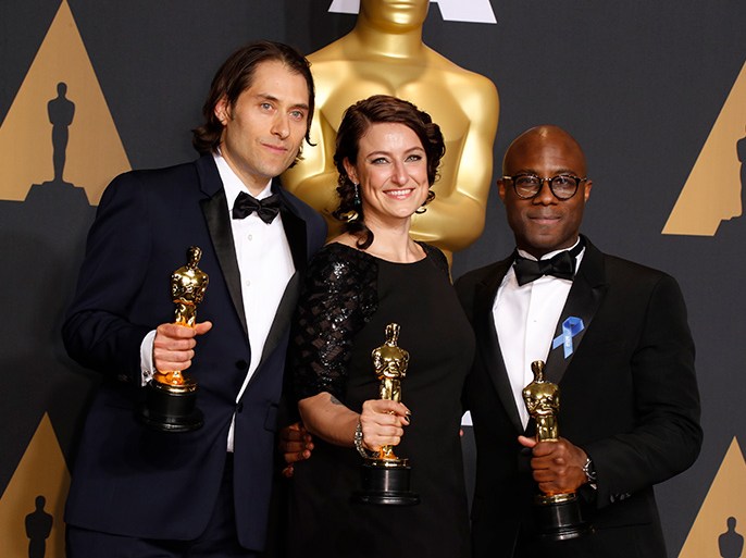 epa05818082 (L-R) Jeremy Kleiner, Adele Romanski, and director Barry Jenkins, hold the Oscar for Best Picture for 'Moonlight' in the press room during the 89th annual Academy Awards ceremony at the Dolby Theatre in Hollywood, California, USA, 26 February 2017. The Oscars are presented for outstanding individual or collective efforts in 24 categories in filmmaking. EPA/PAUL BUCK