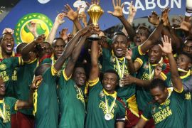Football Soccer - African Cup of Nations - Final - Egypt v Cameroon - Stade d'Angondjé - Libreville, Gabon - 5/2/17 Cameroon's Benjamin Moukandjo celebrates with the trophy and teammates after winning the African Cup of Nations Reuters / Mike Hutchings Livepic