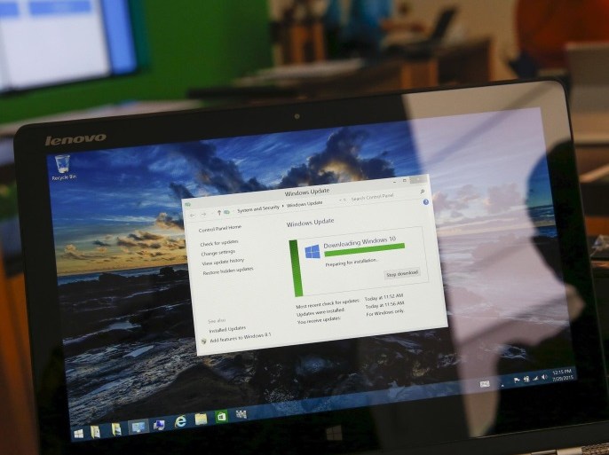 A laptop is seen receiving the free Windows 10 operating system upgrade at the answer desk of the Microsoft store at Roosevelt Field in Garden City, New York July 29, 2015. Microsoft Corp's launch of its first new operating system in almost three years, designed to work across laptops, desktop and smartphones, won mostly positive reviews for its user-friendly and feature-packed interface. REUTERS/Shannon Stapleton