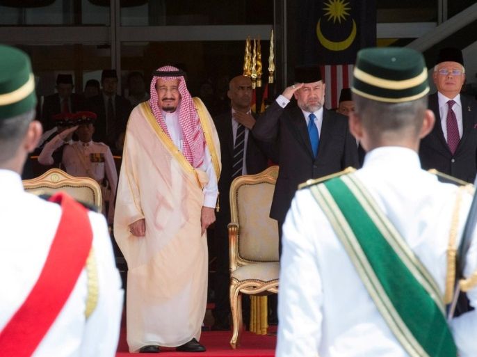Saudi Arabia's King Salman (C) review the honor guard with Malaysia's King Muhammad V and Malaysia's Prime Minister Najib Razak (R) during a welcoming ceremony in Kuala Lumpur, Malaysia, February 26, 2017. Saudi Press Agency/Handout via REUTERS ATTENTION EDITORS - THIS PICTURE WAS PROVIDED BY A THIRD PARTY. FOR EDITORIAL USE ONLY. NO RESALES. NO ARCHIVE.