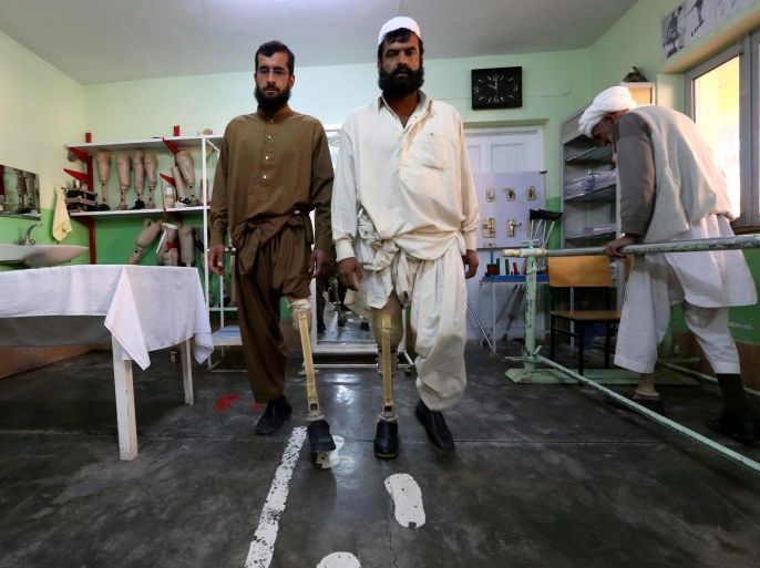 epaselect epa05763035 Afghan victims, who lost their limb in landmines blasts, practice with prosthetic limbs, at International Committee of the Red Cross (ICRC) center in Herat, Afghanistan, 31 January 2017. After almost three decades of war, the countless numbers of mines that remain buried in Afghanistan still kill or maim more than dozens of people every month. As well as being a place for treatment, the Herat center is a small factory where production lines churn o