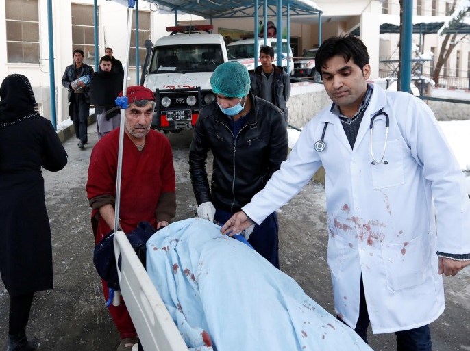 ATTENTION EDITORS - VISUAL COVERAGE OF SCENES OF INJURY OR DEATH Men transport a victim to a hospital after a bomb blast in Kabul, Afghanistan February 7, 2017. REUTERS/Mohammad Ismail