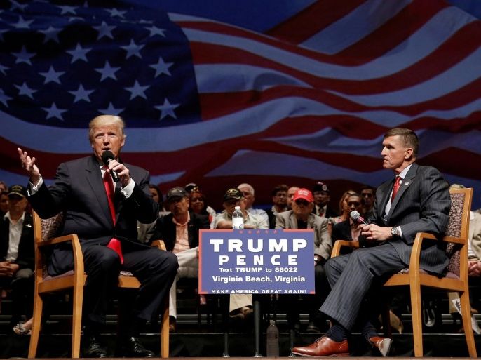 FILE PHOTO : Republican presidential nominee Donald Trump (L) speaks along side retired U.S. Army Lieutenant General Michael Flynn during a campaign town hall meeting in Virginia Beach, Virginia, U.S., September 6, 2016. REUTERS/Mike Segar/File Photo