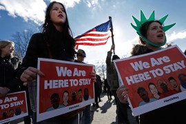 People hold signs and chant during an Immigration Protest Rally in Battery Park in New York, New York, USA, 29 January 2017. In cities all over America people are protesting US President Trump's Immigration executive order barring people from seven Muslim Countries.
