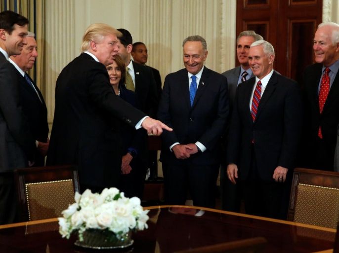 U.S. President Donald Trump (3rd L) arrives for a reception with White House advisor Jared Kushner (L-R), Representative Steny Hoyer (D-MD), House Minority Leader Nancy Pelosi (D-CA), Senate Minority Leader Chuck Schumer (D-NY), Representative Kevin McCarthy (R-CA), Vice President Mike Pence, Senator John Cornyn (R-TX) and Senate Majority Leader Mitch McConnell (R-KY) in the State Dining Room at the White House in Washington, U.S. January 23, 2017. REUTERS/Jonathan Ern