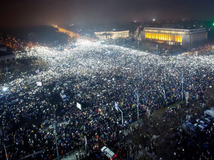 General view of Victoriei Plaza full of protesters flashing the lanterns on their cell-phones, all at the time, during a massive protest in front of government headquarters, background, in Bucharest, Romania, 05 February 2017. Following mass protests, Romania's government repelled today, during an urgency session, their controversial ordnance after on 04 February 2017 they announced the withdrawal of the disputed bill passed late 31 January as a government ordinance t