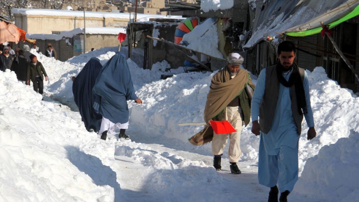 People make their way through a snowy road in Ghazni, Afghanistan, 05 February 2017. Dozens of  people were killed across Afghanistan after three days of continued snowfall.