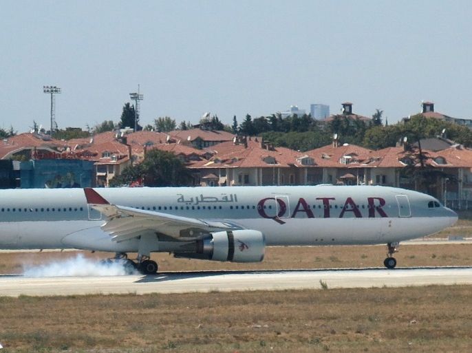 A Qatar Airways aircraft is seen after making an emergency landing at Ataturk International Airport in Istanbul, Turkey, August 18, 2016. The smoke seen at the aircraft's wheels is due to its landing. REUTERS/Stringer FOR EDITORIAL USE ONLY. NO RESALES. NO ARCHIVES.