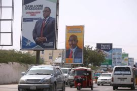 Motorists drive along a street with the campaign billboards of Somalia's Presidential candidates in Somalia's capital Mogadishu, February 6, 2017. REUTERS/Feisal Omar