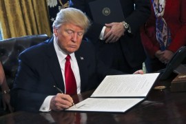 US President Donald J. Trump signs an executive order in the Oval Office of the White House, in Washington, DC, USA, 03 February 2017. Trump signed several executive orders including an order to review the Dodd-Frank Wall Street to roll back financial regulations of the Obama era.