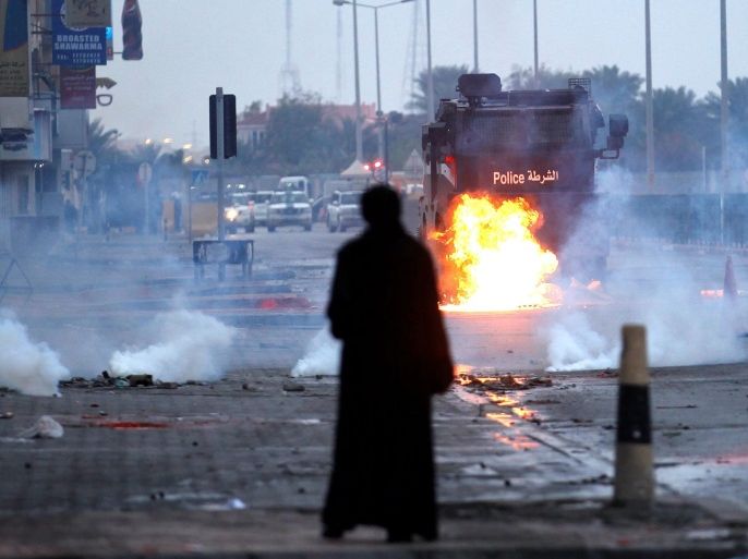 A molotove is seen exploding in front of riot police armoured personnel carrier during a demonstration to mark the 6th anniversary of the February 14 uprising, in the village of Sitra, south of Manama, Bahrain February 14, 2017. REUTERS/Hamad I Mohammed