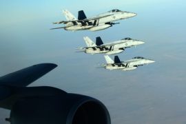 A handout picture made available by the US Department of Defense (DoD) on 25 September 2014 shows a formation of US Navy F-18E Super Hornets leaving after receiving fuel from a KC-135 Stratotanker over northern Iraq, 23 September 2014. These aircraft were part of a large coalition strike package that was the first to strike Islamic State (IS or ISIL) targets in Syria. Airstrikes carried out on late 24 September 2014 against Islamic State targets in Syria hit oil refiner