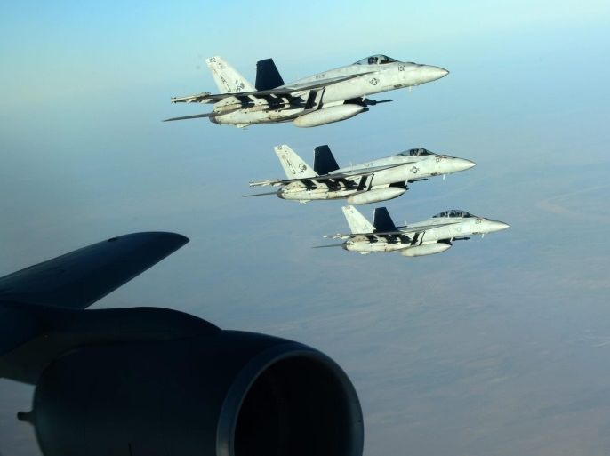 A handout picture made available by the US Department of Defense (DoD) on 25 September 2014 shows a formation of US Navy F-18E Super Hornets leaving after receiving fuel from a KC-135 Stratotanker over northern Iraq, 23 September 2014. These aircraft were part of a large coalition strike package that was the first to strike Islamic State (IS or ISIL) targets in Syria. Airstrikes carried out on late 24 September 2014 against Islamic State targets in Syria hit oil refiner
