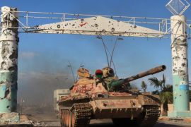 A tank is seen in the city of Sirte, Libya October 16, 2011. Libyan government fighters battled to subdue pockets of resistance by pro-Gaddafi fighters, whose refuse to abandon the ousted leader's hometown of Sirte. REUTERS/Esam Al-Fetori SEARCH "SIRTE TIMELINE" FOR THIS STORY