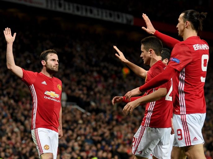 MANCHESTER, ENGLAND - MARCH 16: Juan Mata of Manchester is congratulated after scoring the opening goal during the UEFA Europa League Round of 16 second leg match between Manchester United and FK Rostov at Old Trafford on March 16, 2017 in Manchester, United Kingdom. (Photo by Ross Kinnaird/Getty Images)