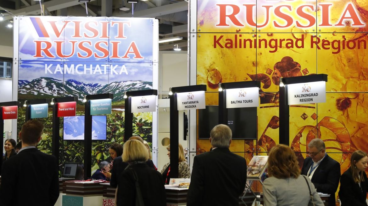 People walk past the Russia booth at the International Tourism Trade Fair ITB in Berlin, Germany, March 8, 2017.      REUTERS/Fabrizio Bensch