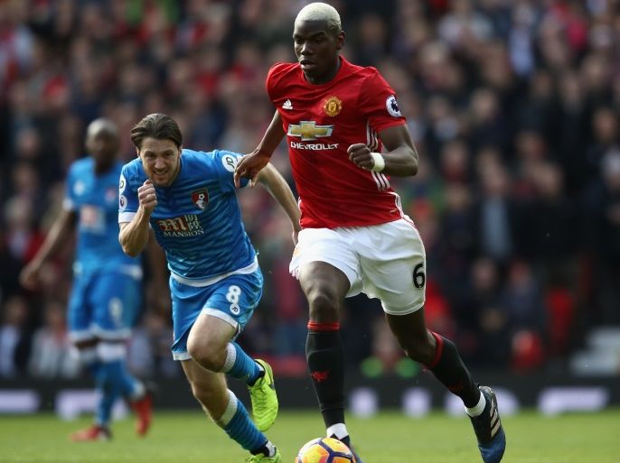 MANCHESTER, ENGLAND - MARCH 04: Paul Pogba of Manchester United (R) moves away from Harry Arter of Bournemouth during the Premier League match between Manchester United and AFC Bournemouth at Old Trafford on March 4, 2017 in Manchester, England. (Photo by Julian Finney/Getty Images)
