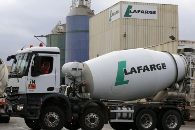 The logo of French building material Lafarge is seen on cement trucks at a production plant in Paris, France, February 22, 2016. In July 2015, Lafarge and Holcim have become one to create a new leader in building materials. REUTERS/Jacky Naegelen