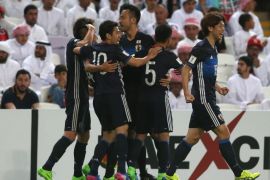 AL AIN CITY, UNITED ARAB EMIRATES - MARCH 23: Yuya Kubo of Japan (2L) celebrates with team mates as he scores their first goal during the FIFA 2018 World Cup qualifying match between United Arab Emirates and Japan at Hazza Bin Zayed Stadium on March 23, 2017 in Al Ain City, United Arab Emirates. (Photo by Francois Nel/Getty Images,)