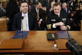 FBI Director James Comey (L) and National Security Agency Director Mike Rogers take their seats at a House Intelligence Committee hearing into alleged Russian meddling in the 2016 U.S. election, on Capitol Hill in Washington, U.S., March 20, 2017. REUTERS/Joshua Roberts
