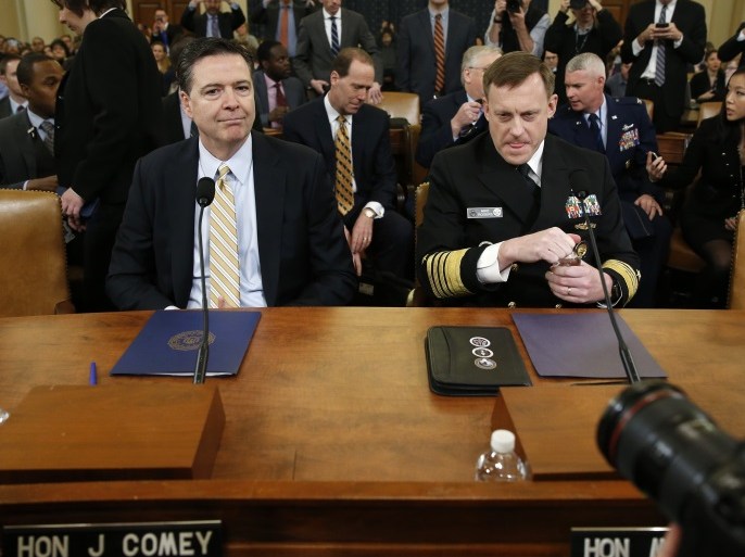 FBI Director James Comey (L) and National Security Agency Director Mike Rogers take their seats at a House Intelligence Committee hearing into alleged Russian meddling in the 2016 U.S. election, on Capitol Hill in Washington, U.S., March 20, 2017. REUTERS/Joshua Roberts