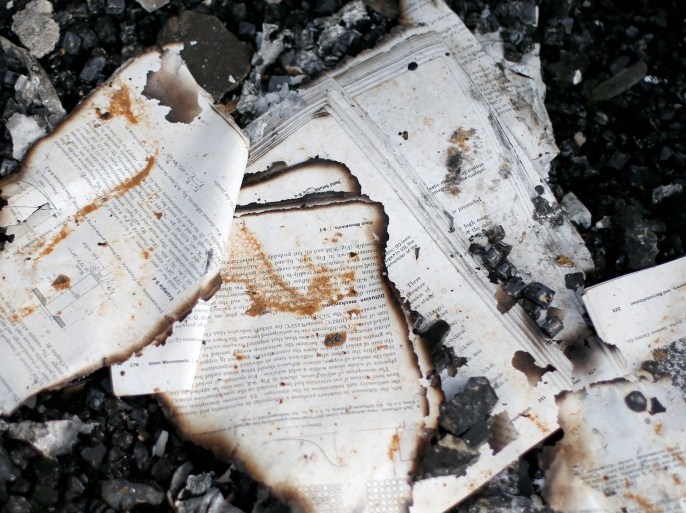 Books burned during the battle with the Islamic State militants, lie in the library of the University of Mosul, Iraq January 30, 2017. Picture taken January 30, 2017. REUTERS/Ahmed Jadallah