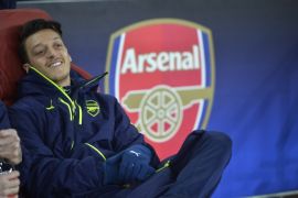 Britain Football Soccer - Arsenal v Bayern Munich - UEFA Champions League Round of 16 Second Leg - Emirates Stadium, London, England - 7/3/17 Arsenal's Mesut Ozil on the substitutes bench Reuters / Hannah McKay Livepic