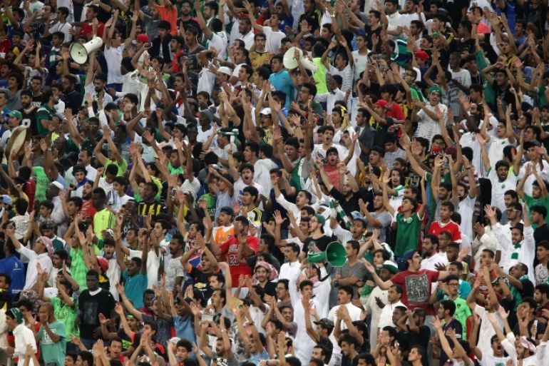 JEDDAH, SAUDI ARABIA, OCTOBER 6: Saudi football fans support their team during the match between Saudi Arabia and Australia for the FIFA World Cup Qualifier Russia 2018, at the Diamond Stadium in Jeddah, Saudi Arabia, October 6, 2016. (Photo by Jordan Pix/ Getty Images)