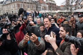 THE HAGUE, NETHERLANDS - MARCH 14: Dutch Prime Minister Mark Rutte takes a selfie photograph with supporters as he campaigns ahead of tomorrow's general election, on March 14, 2017 in The Hague, Netherlands. Campaigning is continuing by all parties ahead of tomorrow's general election in which the right-wing Party for Freedom (PVV), led by Geert Wilders, is expected to do well. (Photo by Carl Court/Getty Images)