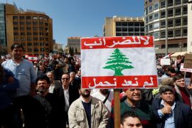 Protesters take part in a demonstration against a proposed tax increase, in front of the government palace in Beirut, Lebanon March 19, 2017. The placard reads in Arabic
